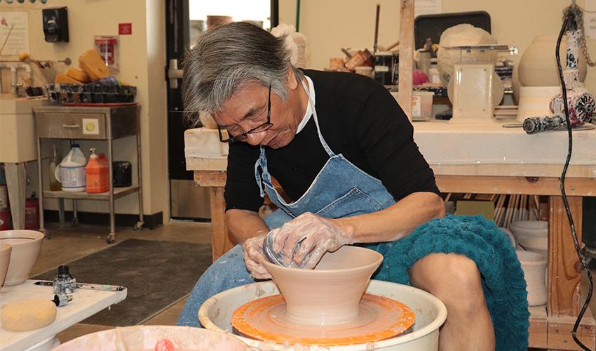 Mr. V. Chin making a big ceramic bowl.